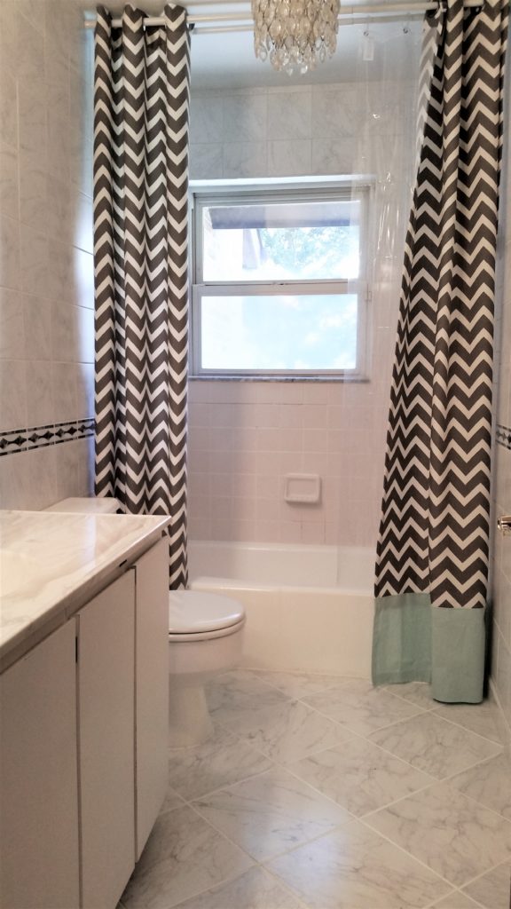 completed painted tub, tile and toilet